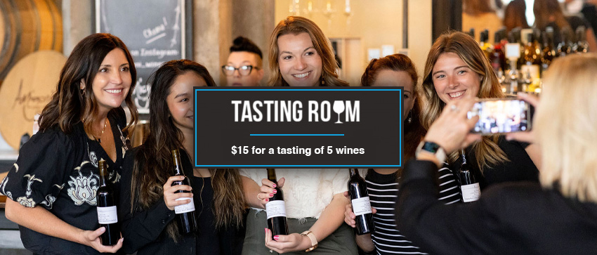 Tasting Room - $15 for a tasting of 5 wines Tasting Room - $15 for a tasting of 5 wines in white text In black box - group of friends with bottles of wine